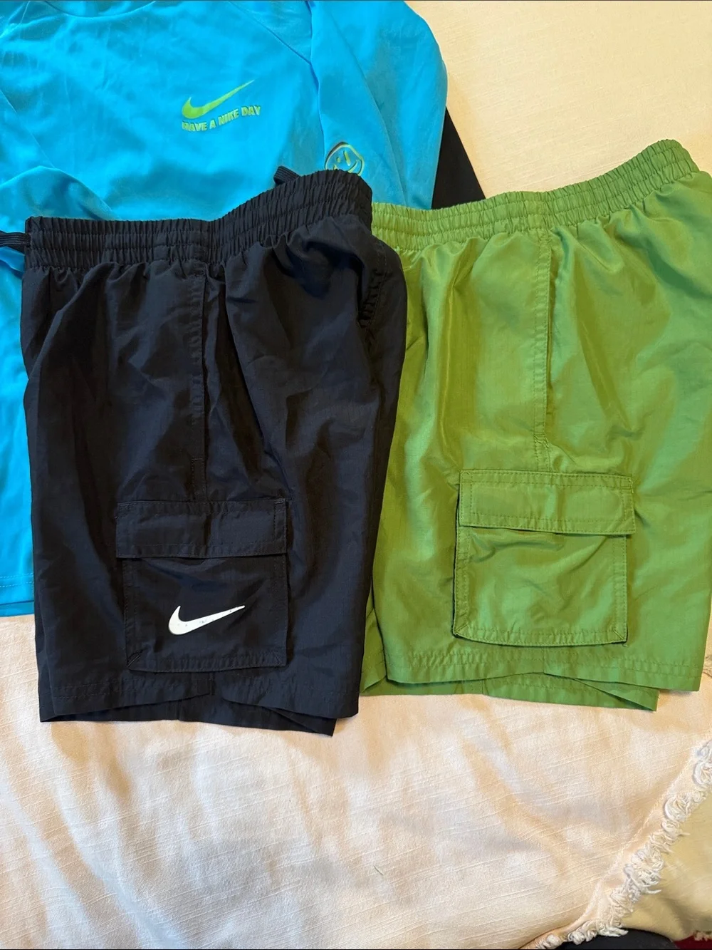 Two sets, Nike rash guard/swim shorts, size small (boys 8-10)